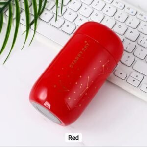 Red insulated stainless steel vacuum bottle with Starry Sky constellation design placed on a desk beside a keyboard.